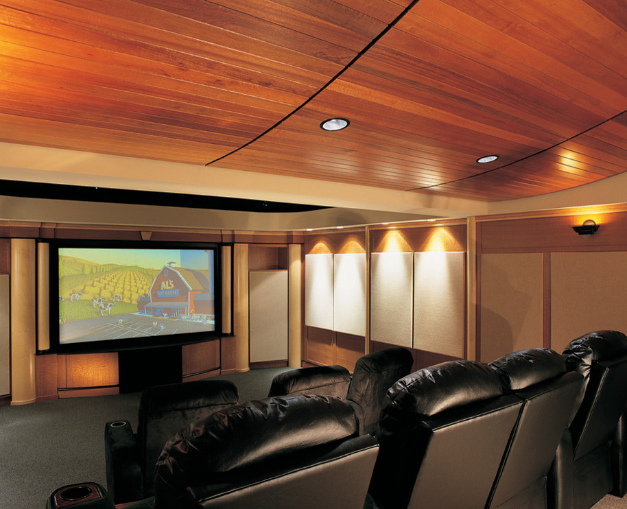 Photo of a large traditional enclosed home theatre in Philadelphia with beige walls, carpet and a built-in media wall.