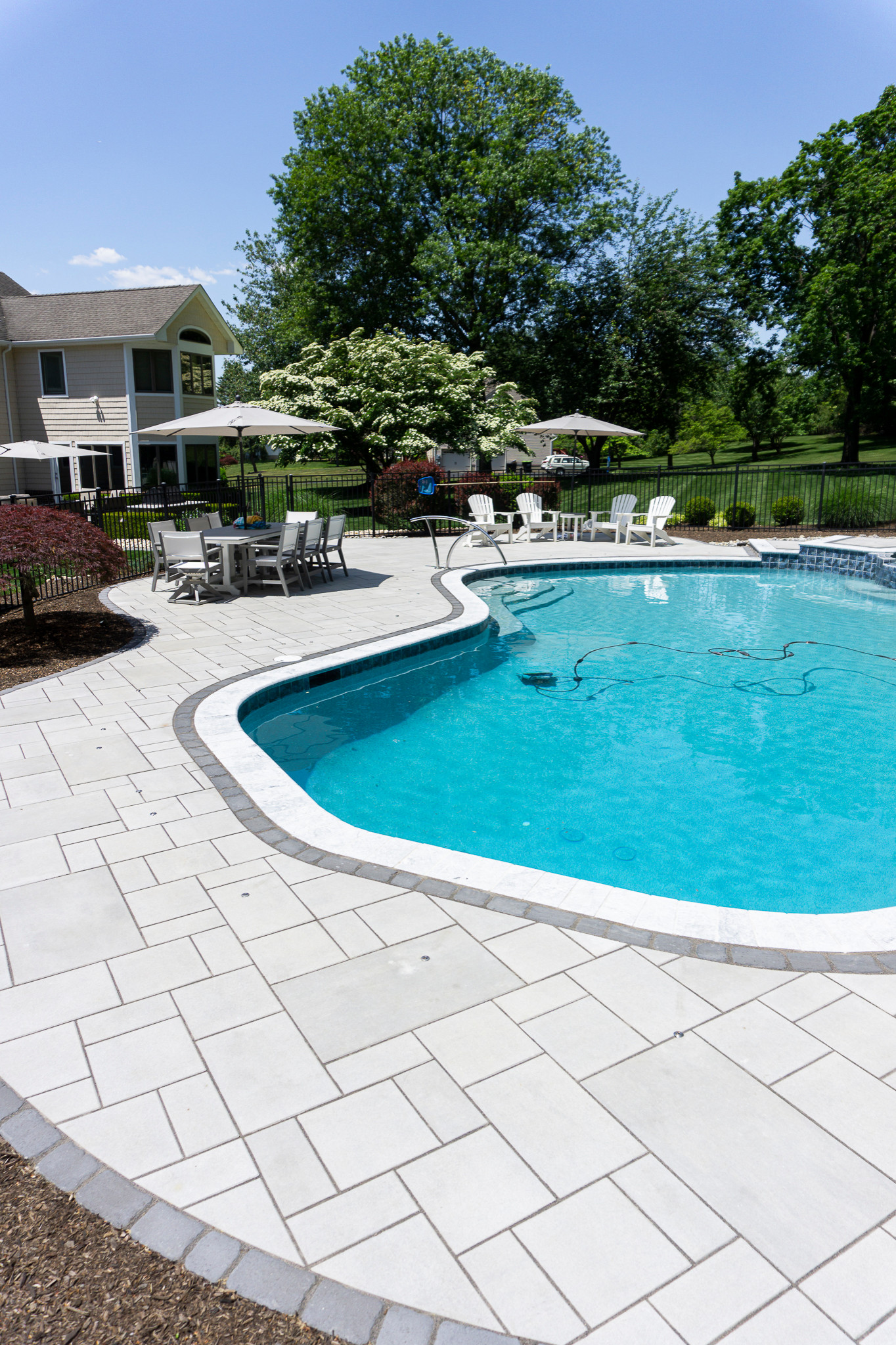 Holmdel, NJ: Paver Patio Installation Surrounding Inground Pool