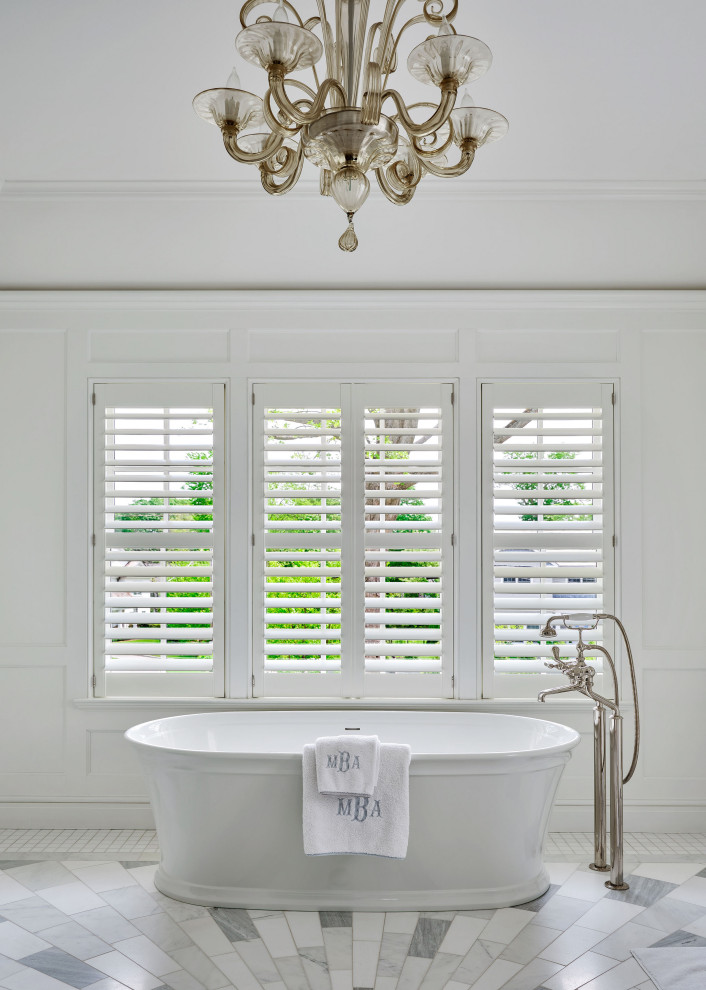 Rye Colonial - Inspiration for a timeless gray floor and wall paneling freestanding bathtub remodel in New York with white walls