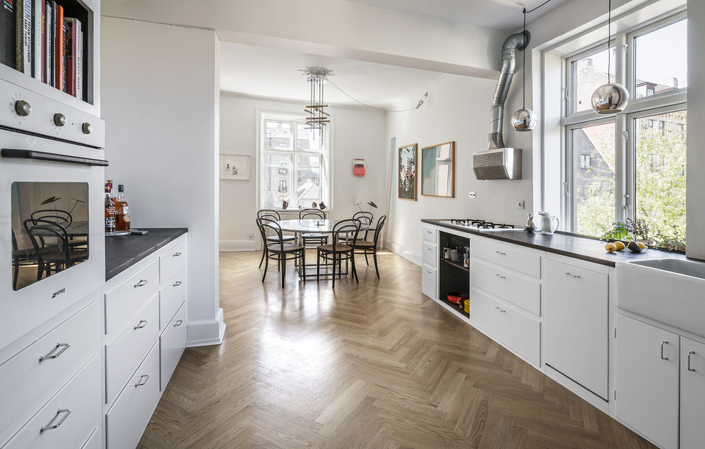 This is an example of a transitional kitchen in Copenhagen.