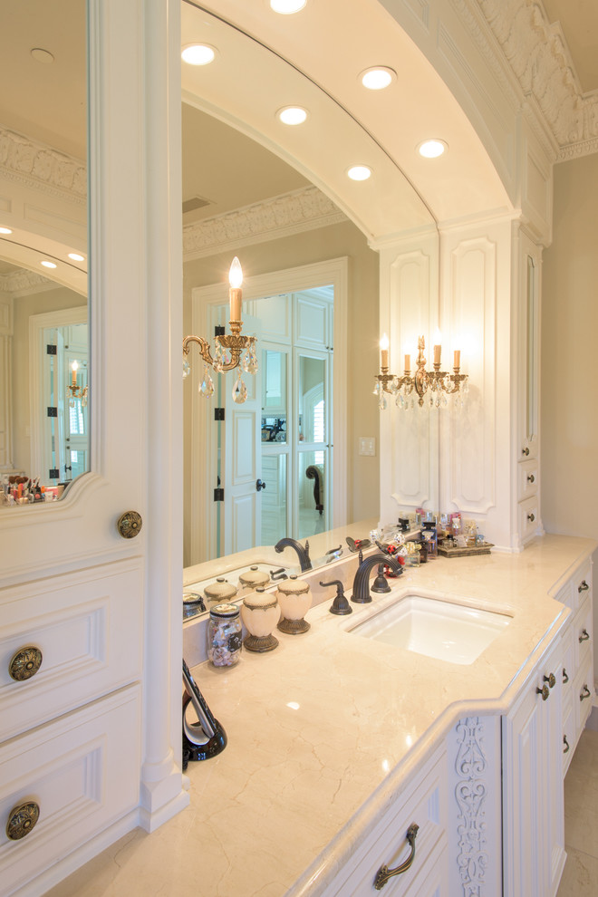 Design ideas for a traditional bathroom in Dallas with marble benchtops and marble floors.