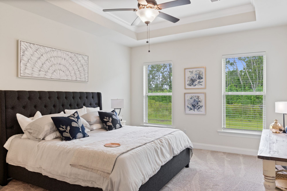 Inspiration for a mid-sized traditional master bedroom in Other with white walls, carpet and beige floor.