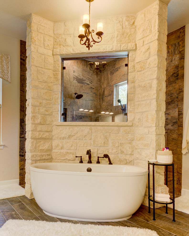Inspiration for a mid-sized country master bathroom in Austin with open cabinets, white cabinets, a freestanding tub, a corner shower, a two-piece toilet, white tile, porcelain tile, beige walls, porcelain floors, granite benchtops, brown floor, an open shower, white benchtops and an undermount sink.