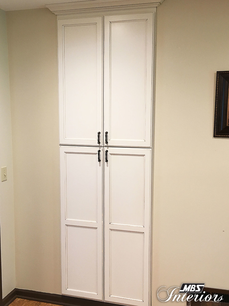 Example of a small transitional u-shaped eat-in kitchen design with an undermount sink, recessed-panel cabinets, white cabinets, quartzite countertops, multicolored backsplash, mosaic tile backsplash, stainless steel appliances and no island