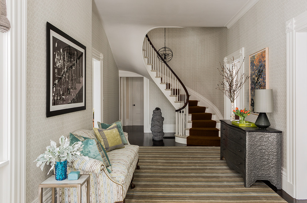 Design ideas for a large transitional foyer in Boston with grey walls and dark hardwood floors.