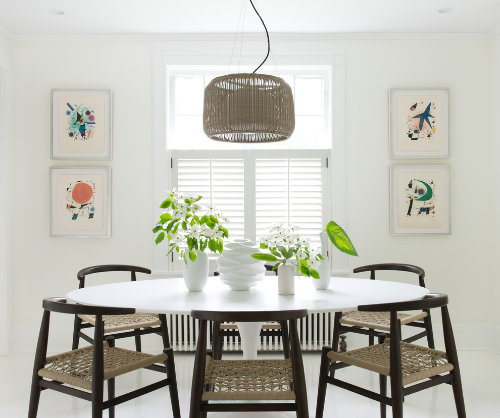 Example of a mid-sized transitional white floor kitchen/dining room combo design in New York with white walls