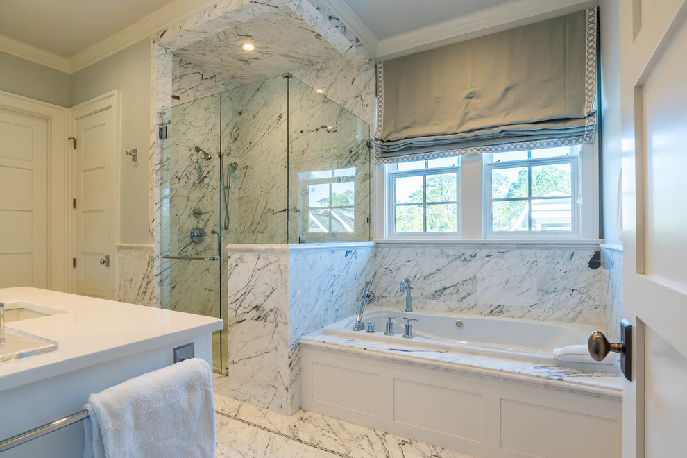 Expansive traditional master bathroom in Other with shaker cabinets, white cabinets, a drop-in tub, a corner shower, black and white tile, marble, grey walls, marble floors, an undermount sink, granite benchtops, white floor, a hinged shower door and white benchtops.