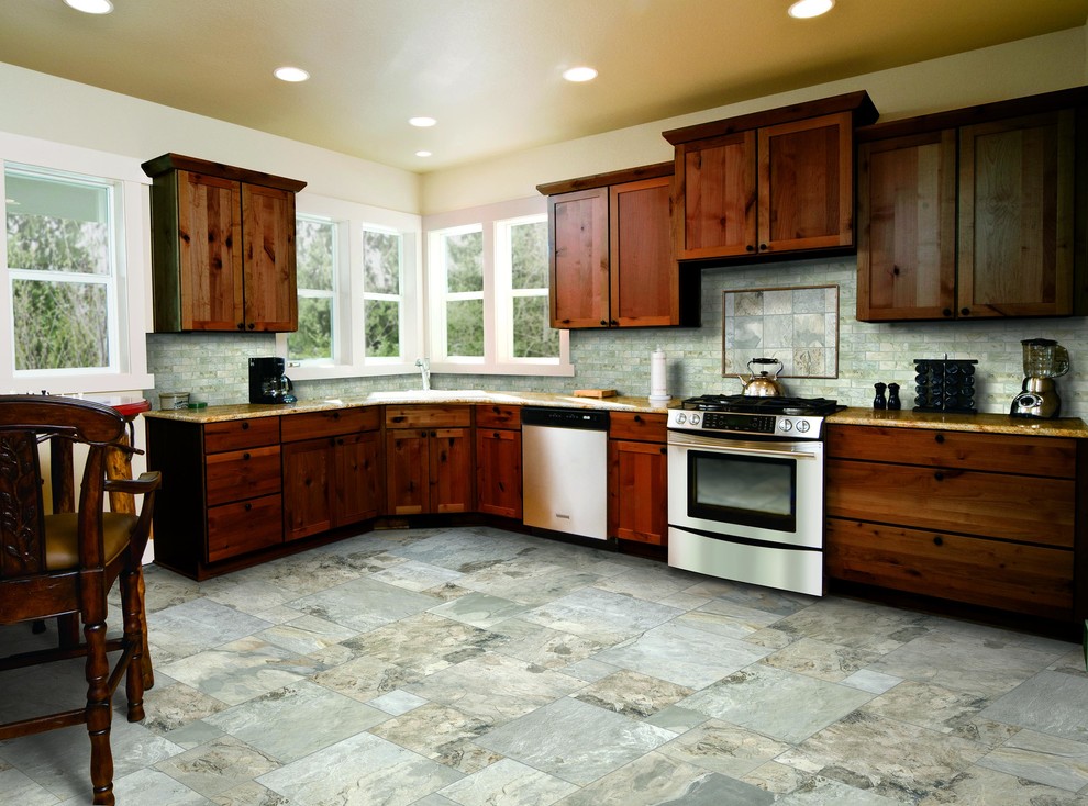 Inspiration for a mid-sized rustic l-shaped slate floor eat-in kitchen remodel with an undermount sink, shaker cabinets, dark wood cabinets, granite countertops, blue backsplash, stone tile backsplash, stainless steel appliances and no island