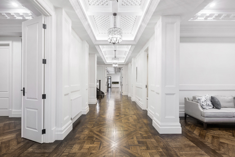 This is an example of an expansive traditional entry hall in Melbourne with white walls, medium hardwood floors, a double front door, a metal front door and brown floor.
