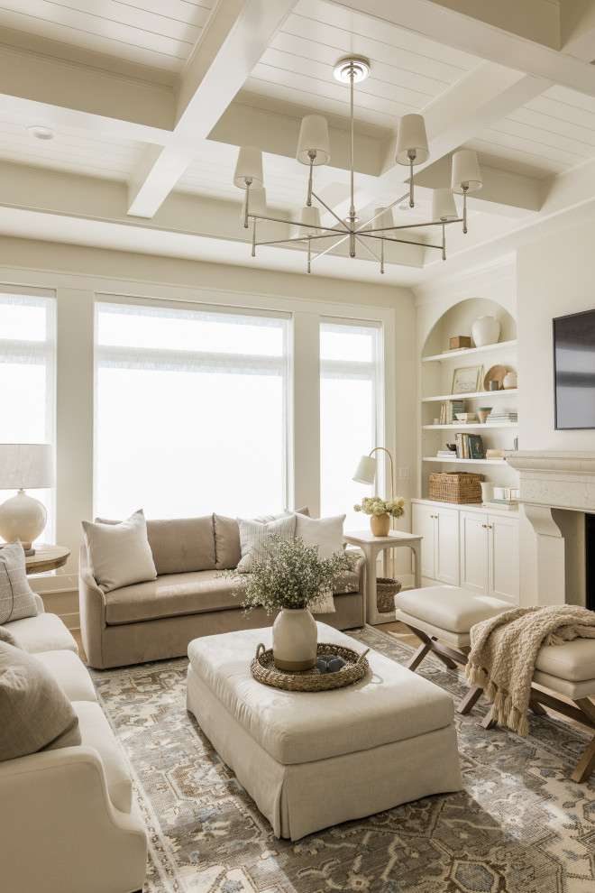 Inspiration for a mid-sized traditional open concept living room in Other with white walls, light hardwood floors, a standard fireplace, a stone fireplace surround, a wall-mounted tv and coffered.