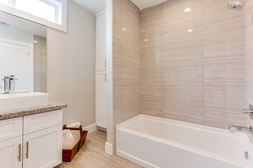 Inspiration for a small transitional bathroom with shaker cabinets, white cabinets, an alcove tub, a shower/bathtub combo, beige tile, porcelain tile, beige walls, porcelain floors, a vessel sink, granite benchtops, beige floor and a shower curtain.