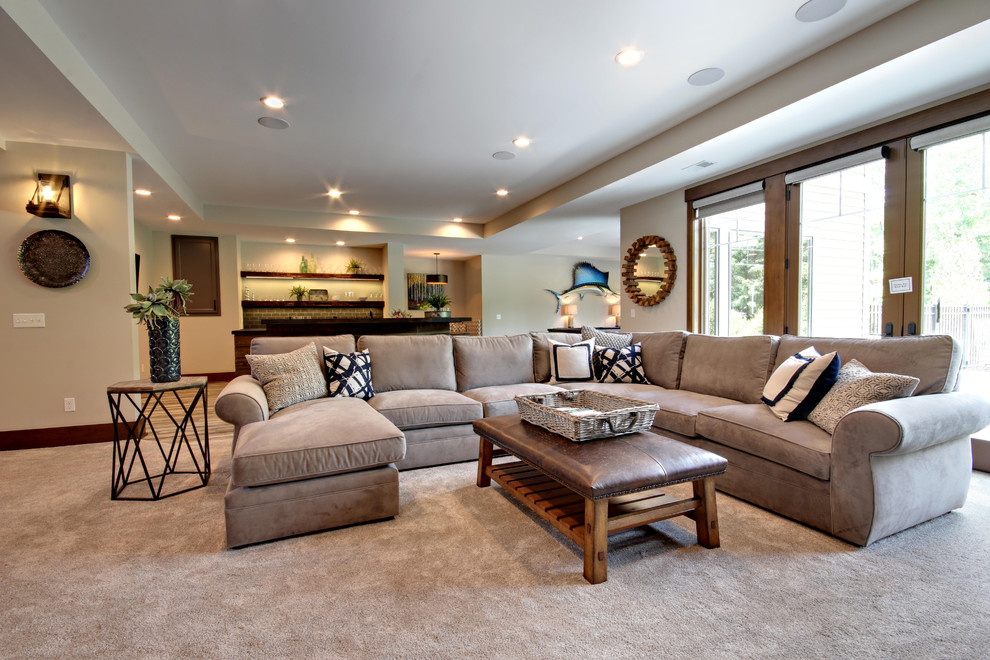 Transitional open concept family room in Grand Rapids with beige walls, carpet and beige floor.