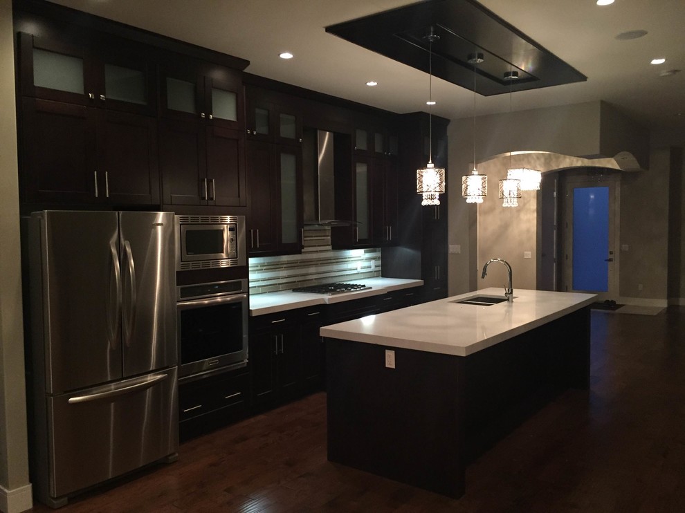 Example of a transitional kitchen design in Calgary