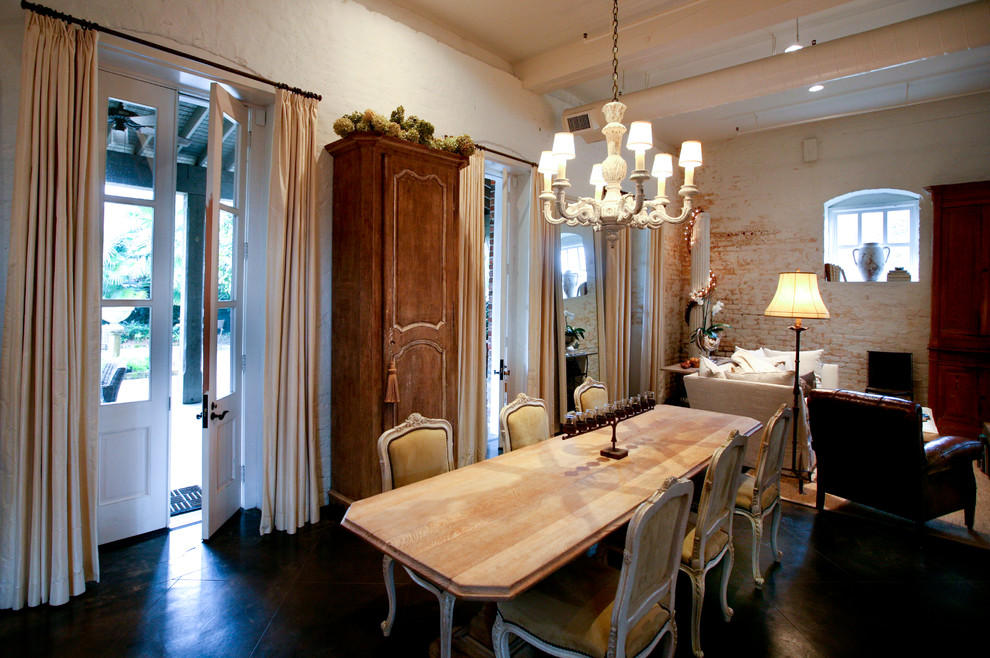 Large traditional separate dining room in Miami with white walls, porcelain floors, no fireplace and brown floor.