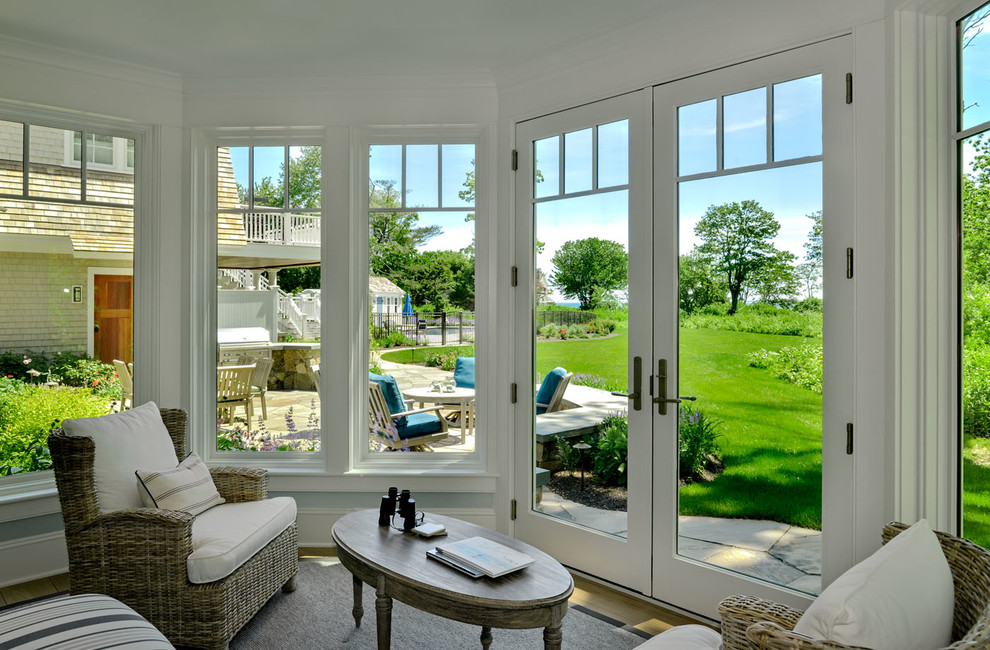 Inspiration for a mid-sized coastal light wood floor and beige floor sunroom remodel in Boston with a standard ceiling and no fireplace
