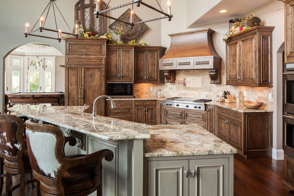 Inspiration for a mid-sized rustic l-shaped medium tone wood floor enclosed kitchen remodel with an undermount sink, glass-front cabinets, beige cabinets, solid surface countertops, gray backsplash, marble backsplash, stainless steel appliances and no island