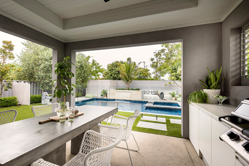 Inspiration for a contemporary backyard patio in Perth with concrete slab and a roof extension.
