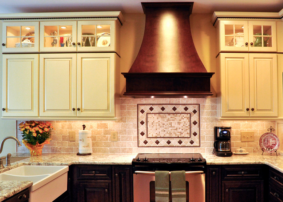 Example of a kitchen design in DC Metro with beaded inset cabinets, white cabinets and beige backsplash