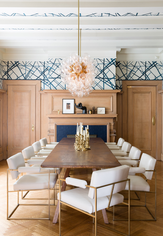 Inspiration for a large transitional separate dining room in San Francisco with multi-coloured walls, medium hardwood floors, a standard fireplace, a tile fireplace surround and brown floor.