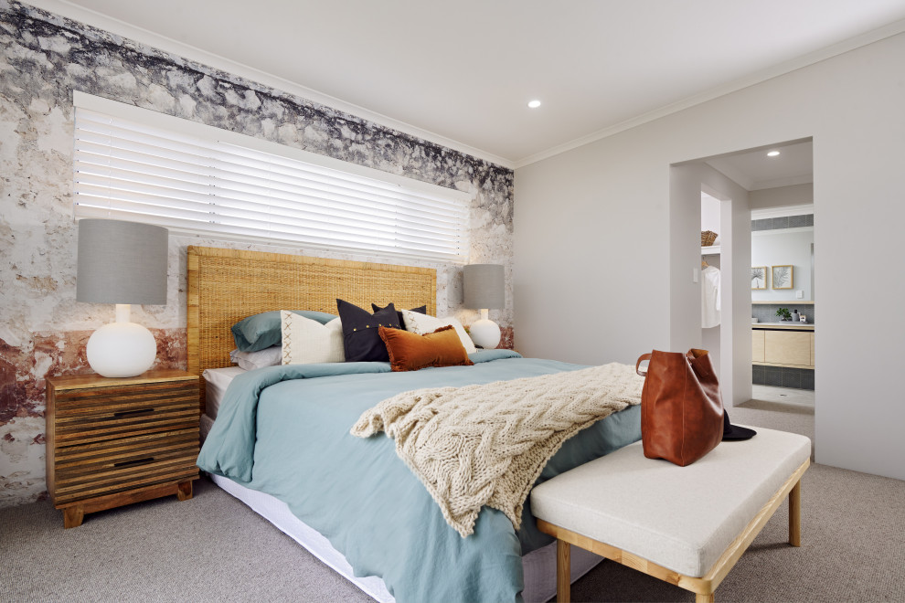 This is an example of a mid-sized beach style master bedroom in Perth with beige walls, carpet, no fireplace, grey floor and wallpaper.