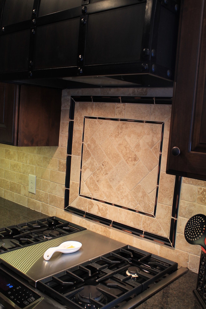 Inspiration for a mid-sized rustic u-shaped medium tone wood floor kitchen remodel with raised-panel cabinets, dark wood cabinets, granite countertops, beige backsplash, ceramic backsplash, black appliances and an island