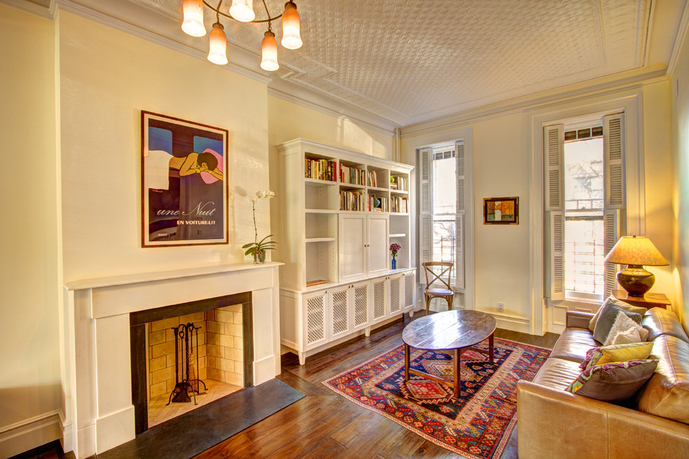 This is an example of a traditional enclosed living room in New York with a library.