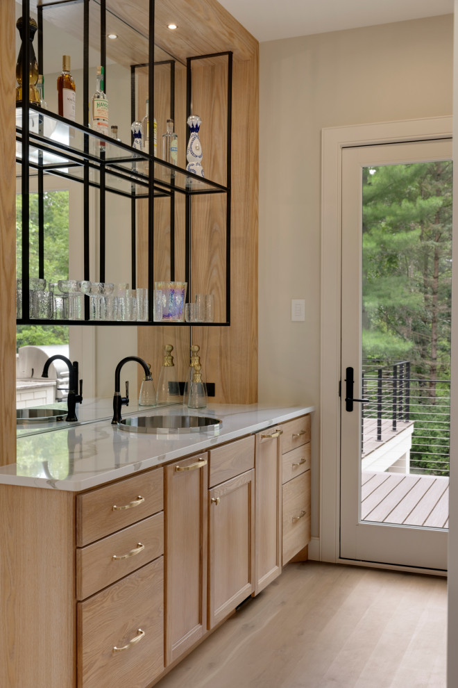 Example of a beach style home bar design in Minneapolis