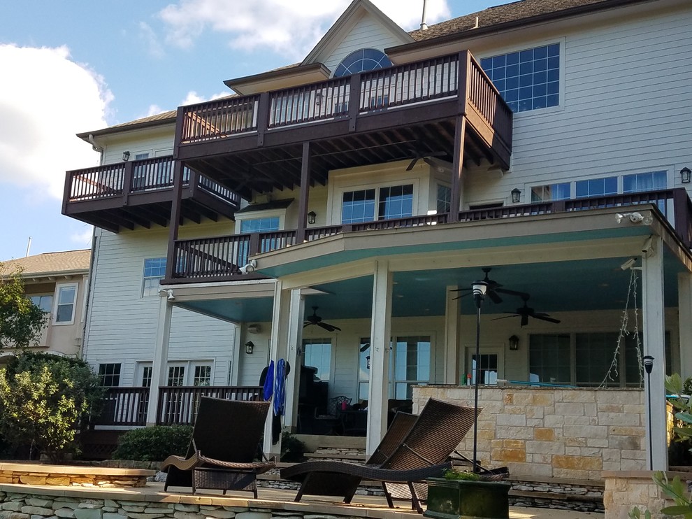 Inspiration for a large transitional backyard stone patio remodel in Austin with no cover