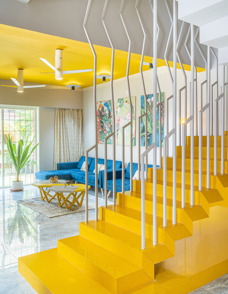 Contemporary staircase in Ahmedabad with metal railing.