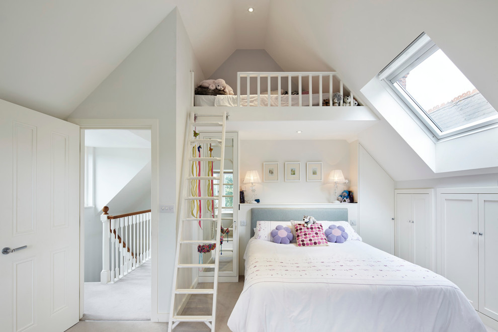 Photo of a traditional kids' bedroom for girls in London with white walls and carpet.