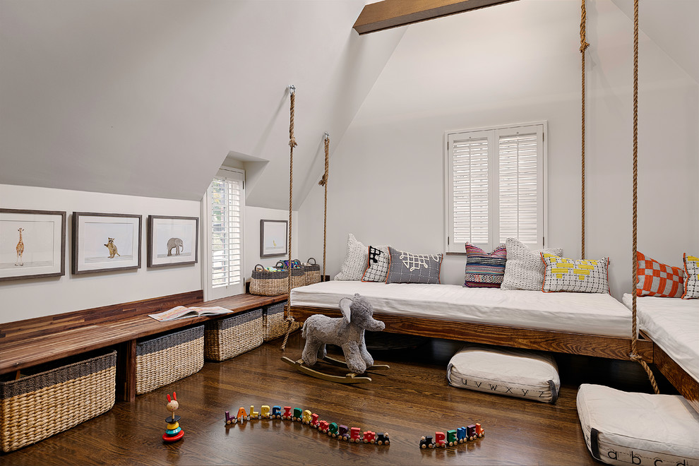 This is an example of a mid-sized transitional gender-neutral kids' room in Other with white walls, dark hardwood floors and brown floor.