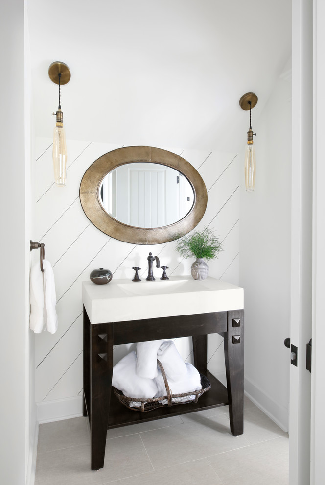 Photo of a country powder room with white walls, a console sink, grey floor and white benchtops.