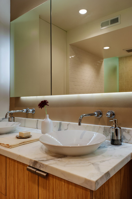 Floating mirror at vanity modern-bathroom