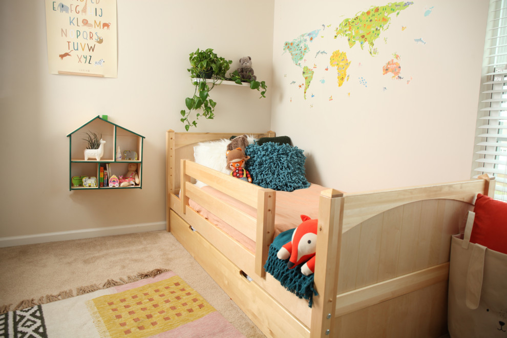 Example of a small mountain style gender-neutral kids' room design in Other with green walls