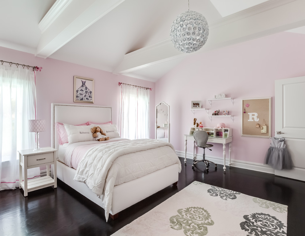 Photo of a large transitional kids' room for girls in New York with pink walls.