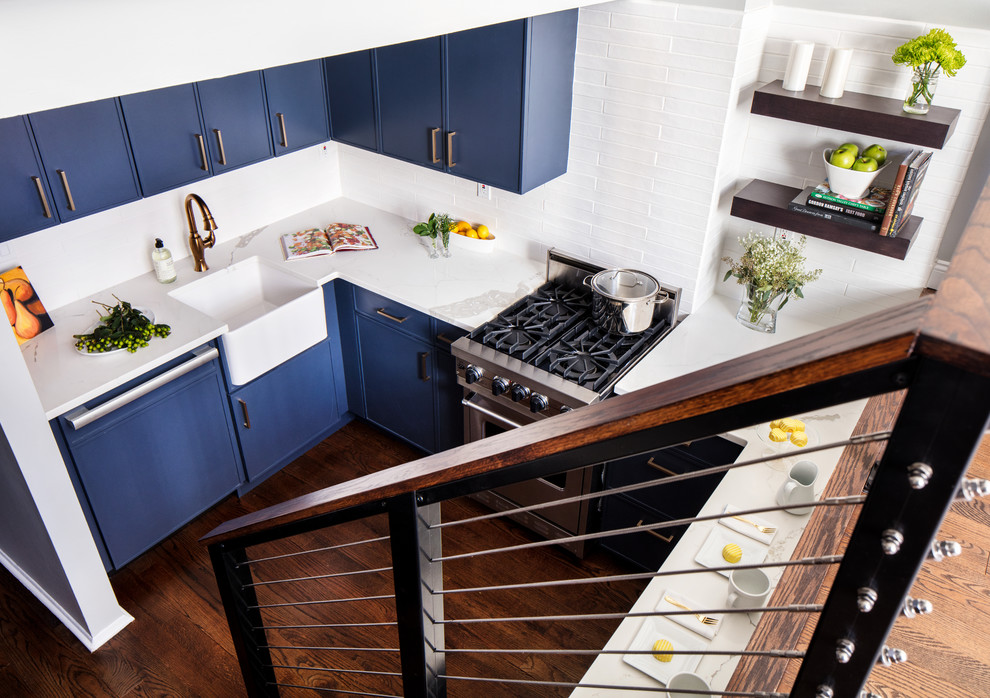 Kitchen - small transitional dark wood floor and brown floor kitchen idea in New York with a farmhouse sink, blue cabinets, white backsplash, ceramic backsplash, colored appliances and no island
