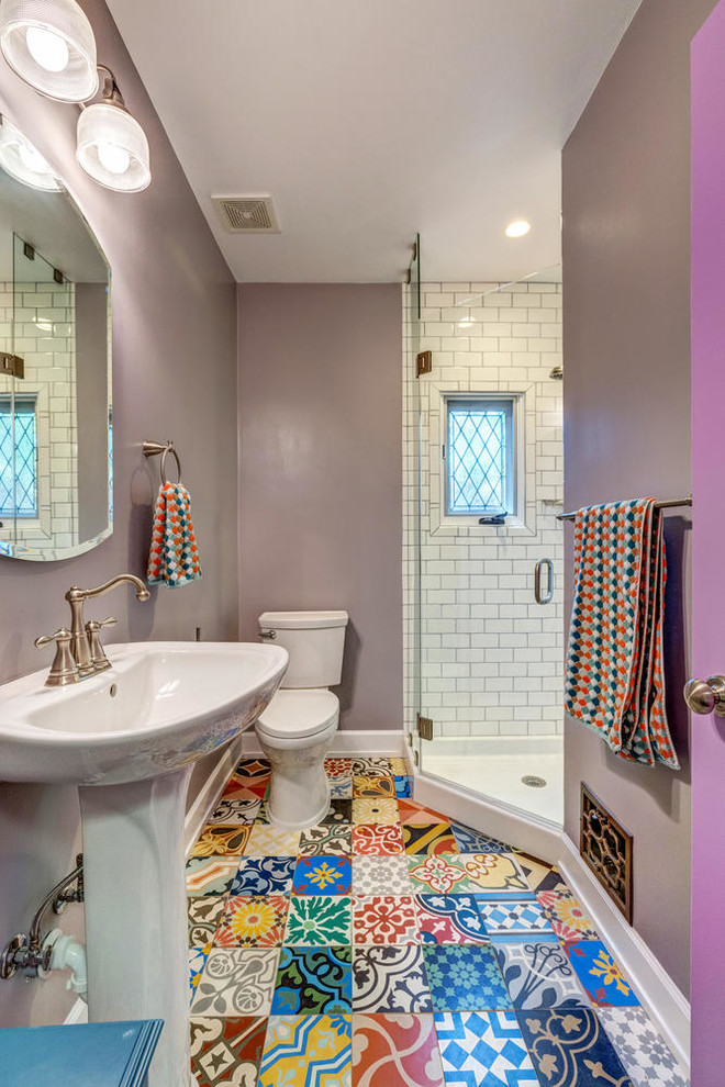 Inspiration for a small transitional 3/4 bathroom in Los Angeles with shaker cabinets, a corner shower, a two-piece toilet, white tile, ceramic tile, purple walls, cement tiles, a pedestal sink, multi-coloured floor and a hinged shower door.