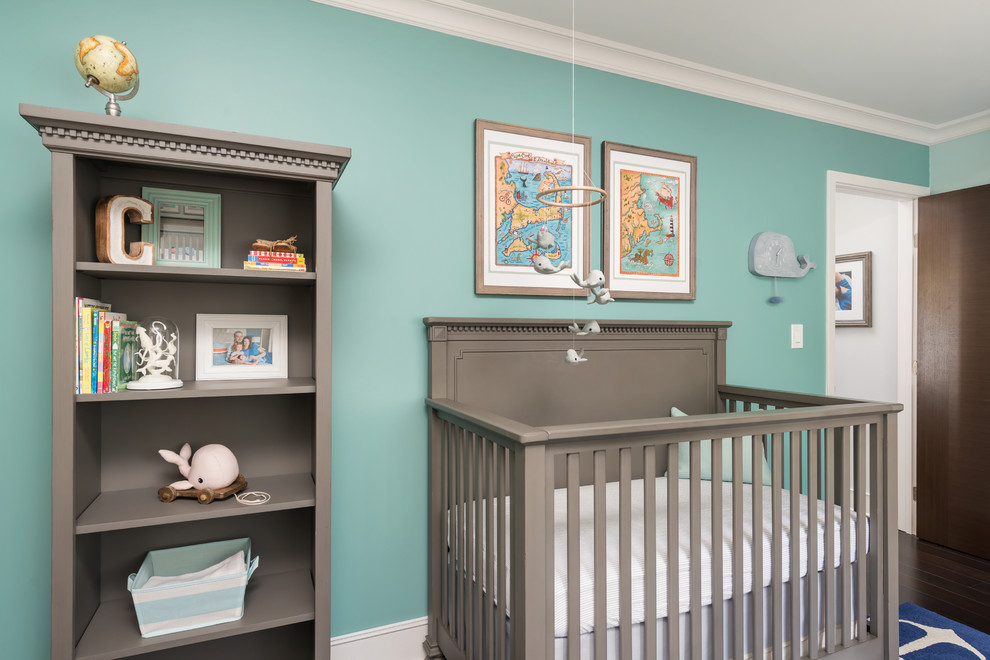 Photo of a mid-sized traditional nursery for boys in San Francisco with green walls and dark hardwood floors.