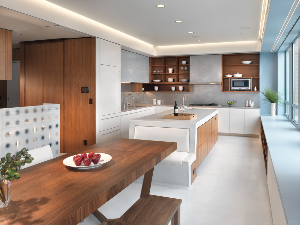 Modern l-shaped eat-in kitchen in San Francisco with open cabinets, medium wood cabinets, grey splashback, panelled appliances and an undermount sink.