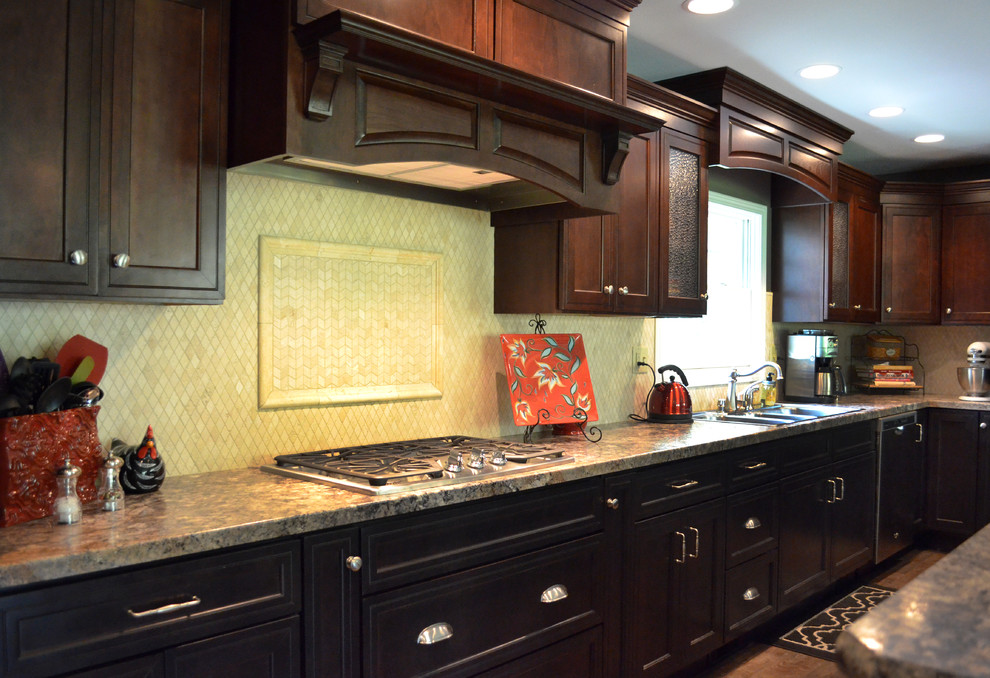 Mid-sized traditional l-shaped kitchen in St Louis with flat-panel cabinets, brown cabinets, laminate benchtops and with island.