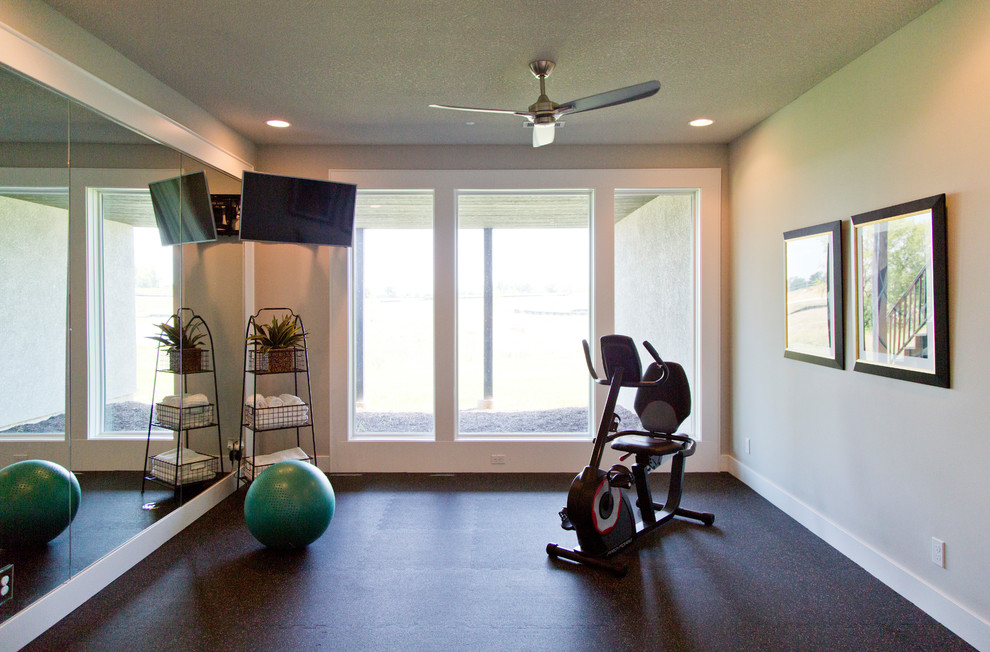 This is an example of a large transitional multipurpose gym in Kansas City with beige walls and multi-coloured floor.