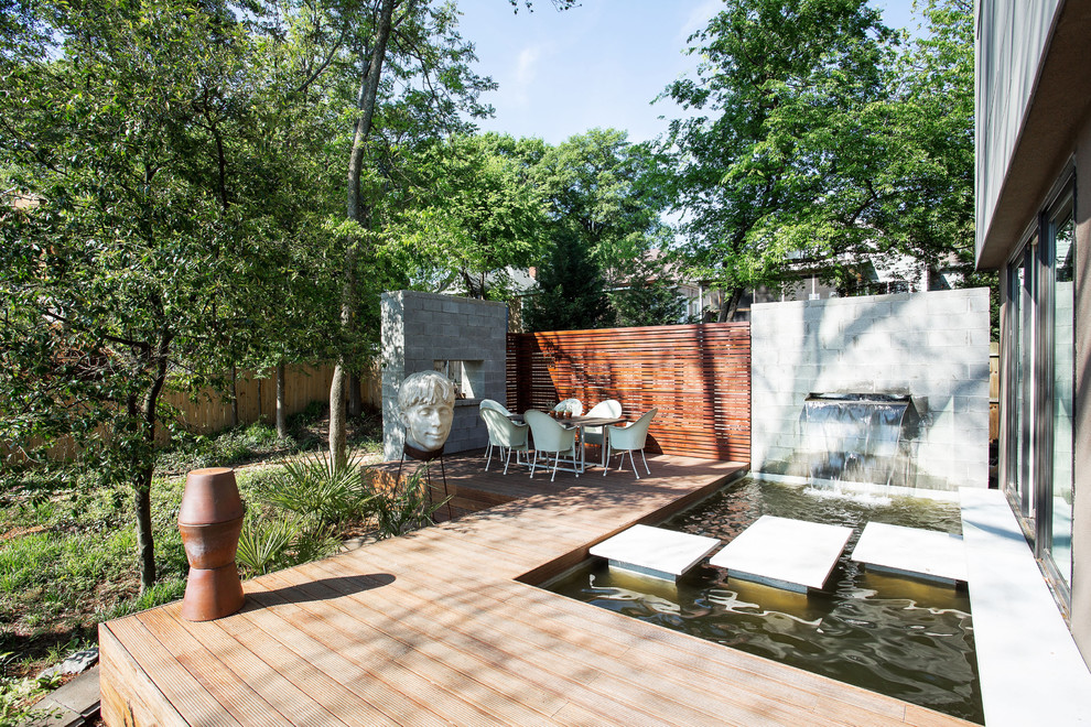 This is an example of a mid-sized contemporary backyard deck in Atlanta.