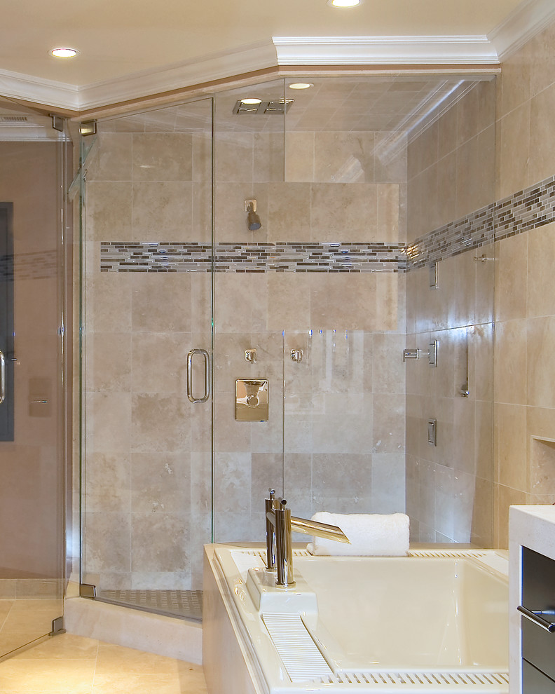 Inspiration for a contemporary master bathroom in San Francisco with an undermount sink, flat-panel cabinets, dark wood cabinets, limestone benchtops, a drop-in tub, a corner shower, a two-piece toilet, beige tile, stone tile, beige walls and limestone floors.