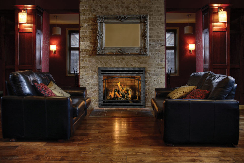 This is an example of a large traditional formal open concept living room in Denver with red walls, dark hardwood floors, a standard fireplace, a brick fireplace surround and no tv.