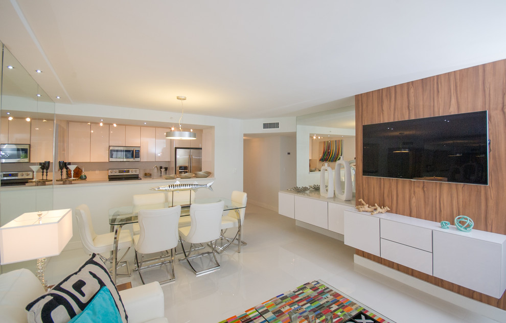 Photo of a small modern kitchen/dining combo in Miami with white walls, porcelain floors, no fireplace and white floor.