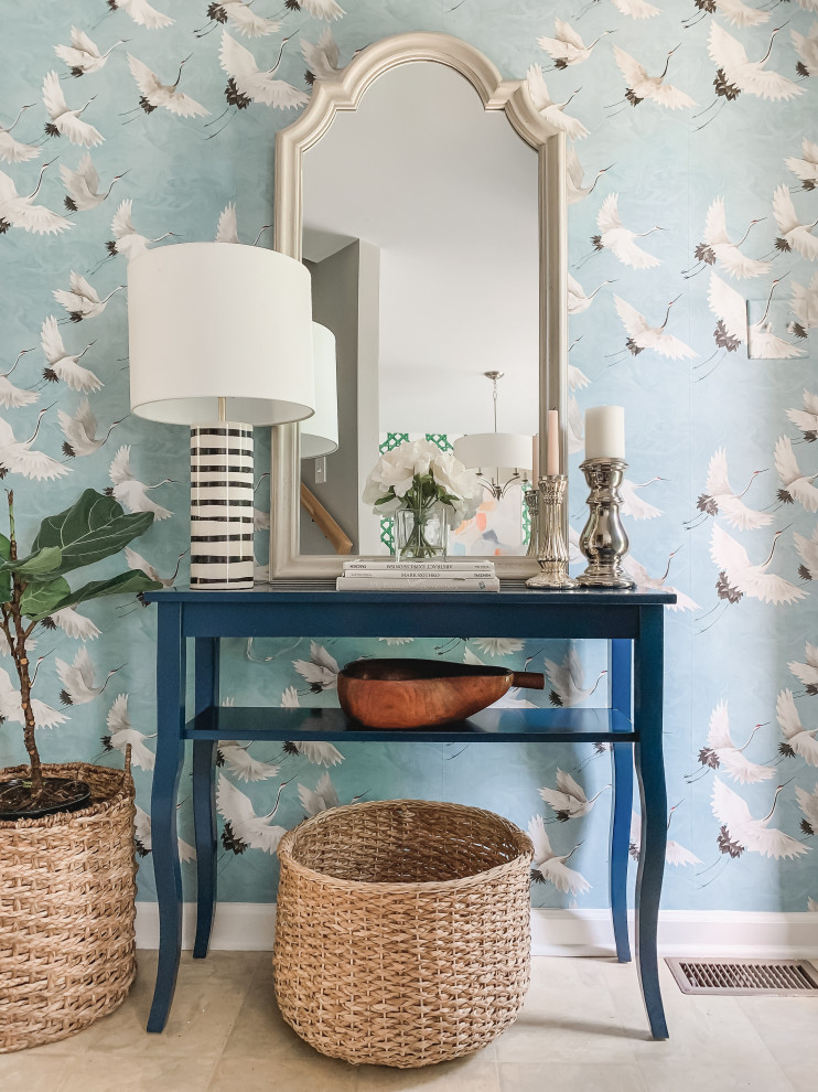 Inspiration for a small beach style foyer in Other with blue walls, a single front door, a blue front door and wallpapered walls.