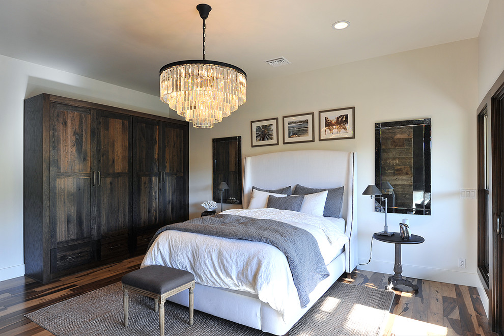 Inspiration for a country bedroom in Other with white walls and dark hardwood floors.