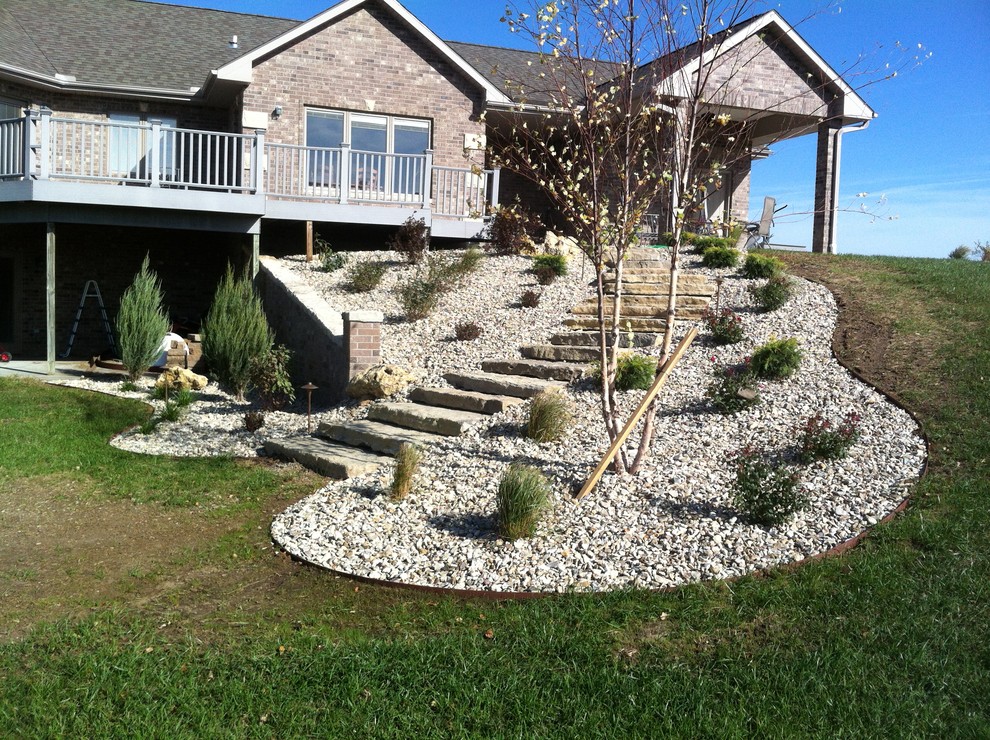 Photo of a large traditional hillside landscaping.