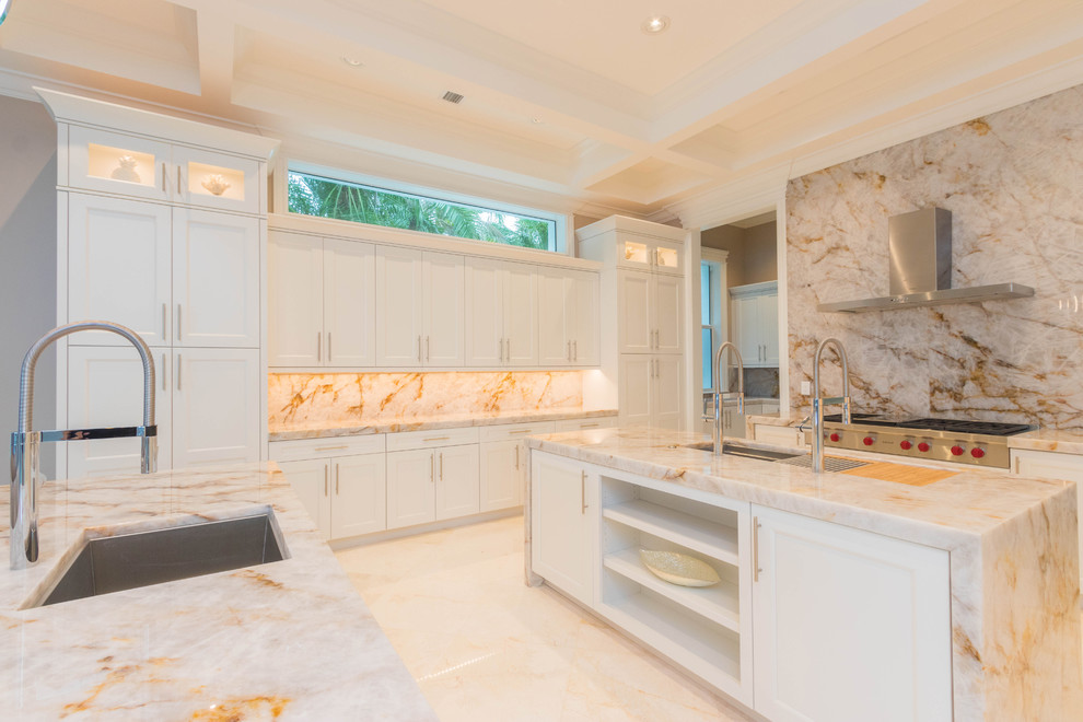 Open concept kitchen - huge transitional u-shaped marble floor and white floor open concept kitchen idea with an undermount sink, flat-panel cabinets, white cabinets, quartzite countertops, white backsplash, stone slab backsplash and two islands