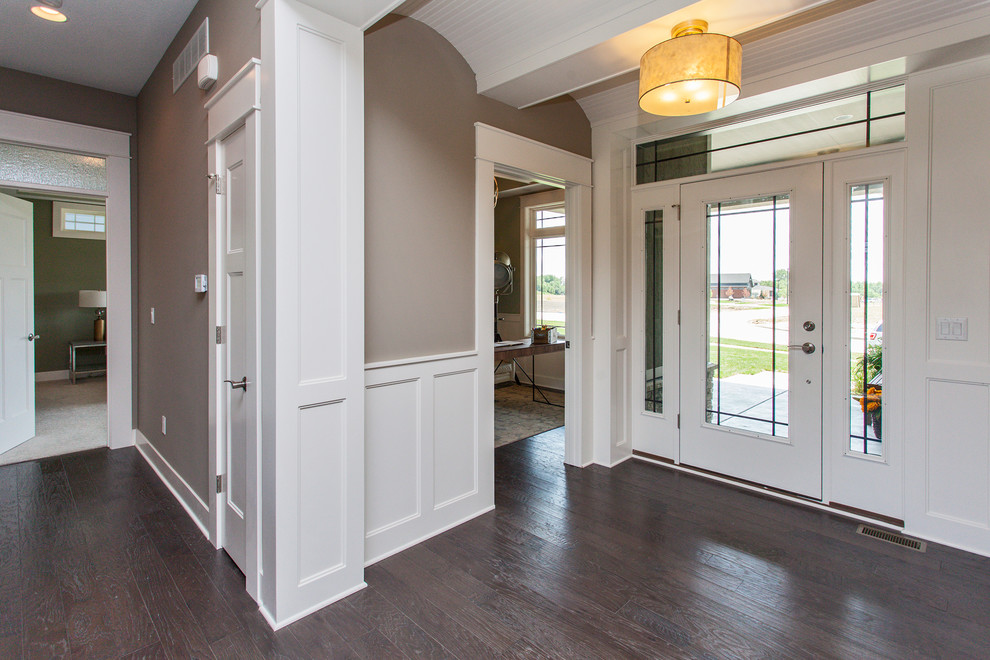 Transitional dark wood floor entryway photo